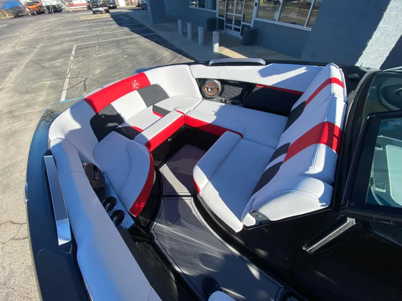 Slide: The Image of 2021 MasterCraft X26 boat interior with red and gray seating. - 33