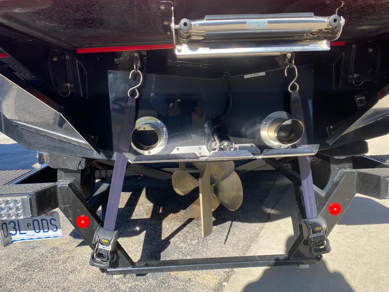 Slide: The Image of 2021 MasterCraft X26 boat stern with propeller and exhaust system. - 7