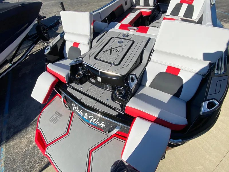 Slide: The Image of 2021 MasterCraft X26 boat with stylish seating and modern design. - 9