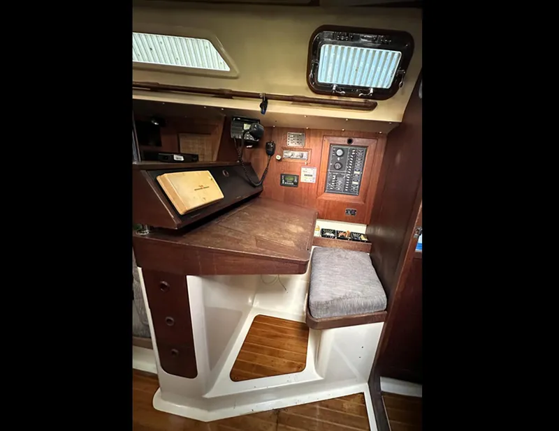 Slide: The Image of 1989 Canadian Sailcraft CS40 yacht interior with navigation station and control panel. - 20