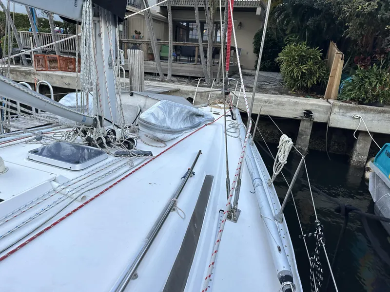 Slide: The Image of 1989 Canadian Sailcraft CS40 sailboat docked, showcasing deck and rigging details. - 47