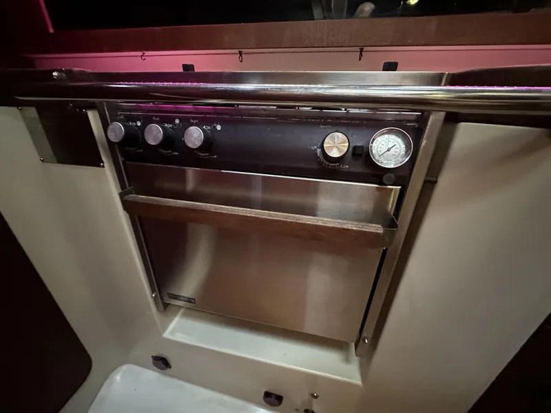 Slide: The Image of 1989 Canadian Sailcraft CS40 yacht interior with stainless steel oven and control knobs. - 8