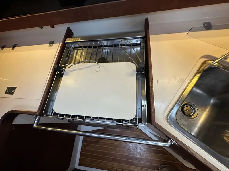 Slide: The Image of 1989 Canadian Sailcraft CS40 yacht kitchen with stove and sink. - 9