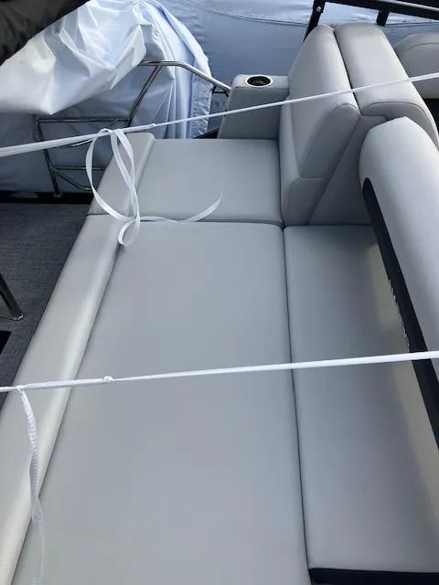 Slide: The Image of 2025 Harris Cruiser 210 boat with sleek, modern seating design. - 17