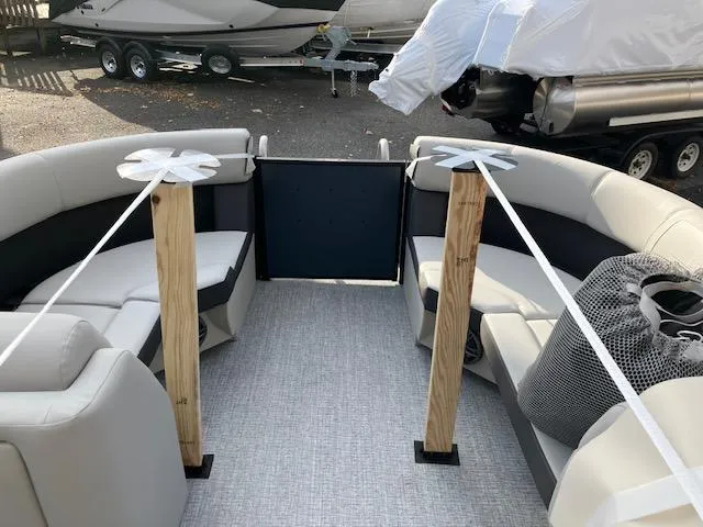 Slide: The Image of 2025 Harris Cruiser 210 interior with spacious seating and modern design. - 8