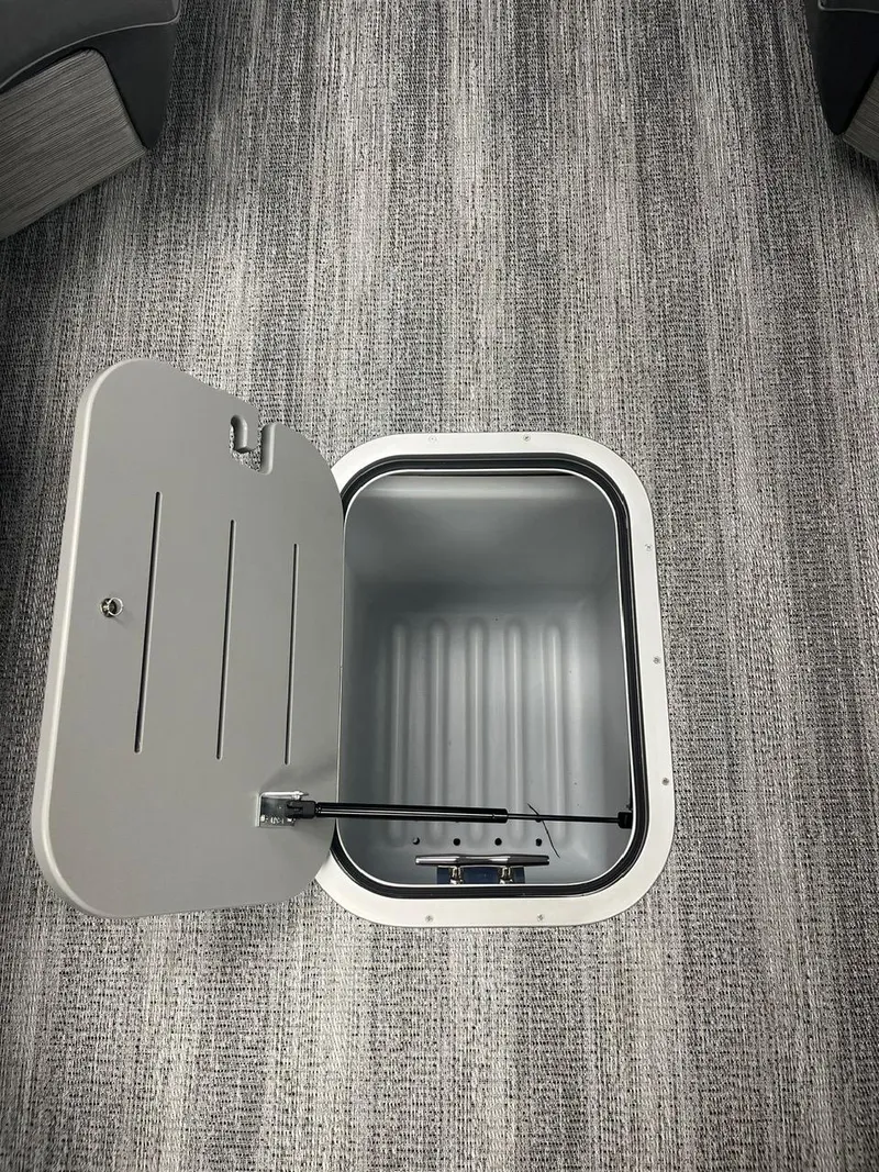 Slide: The Image of Open storage compartment on 2025 Bennington 24 MSB boat, featuring sleek design and functionality. - 15