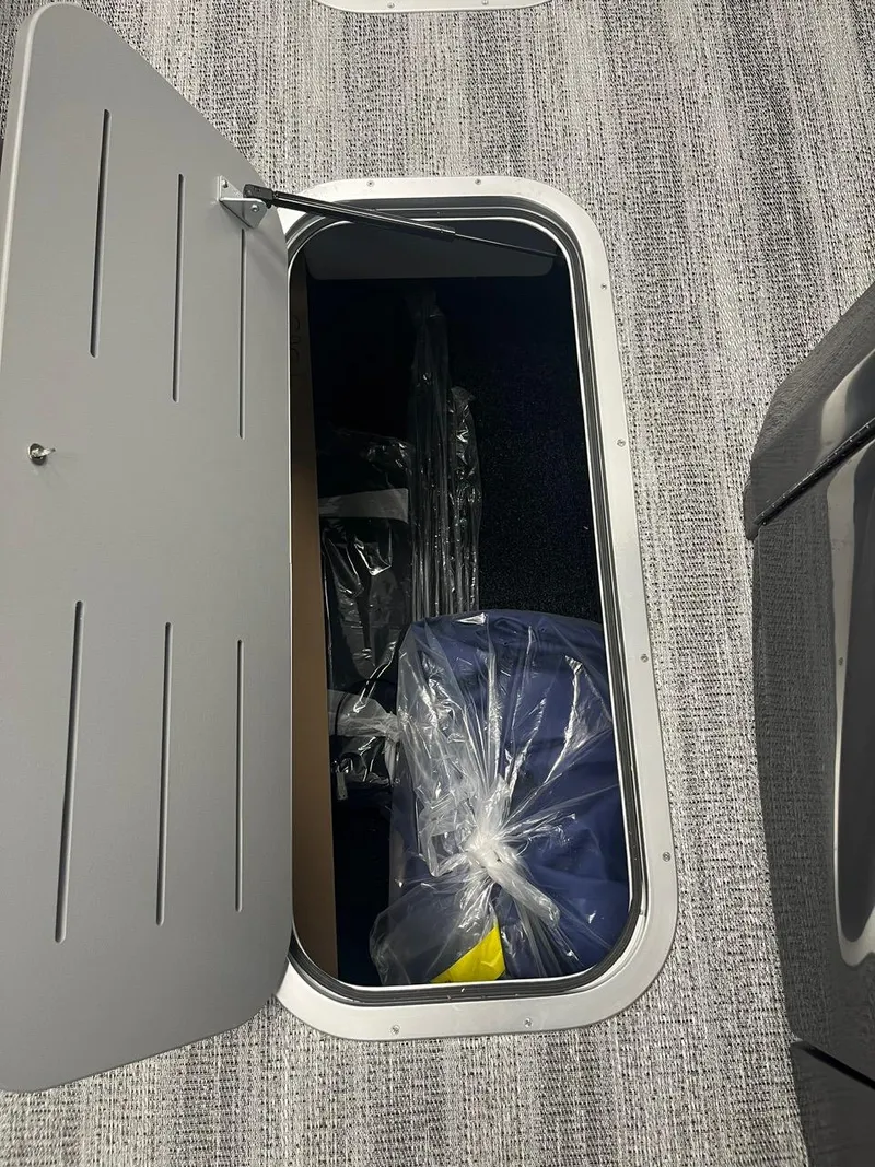 Slide: The Image of Storage compartment in 2025 Bennington 24 MSB boat, featuring secure interior space. - 3