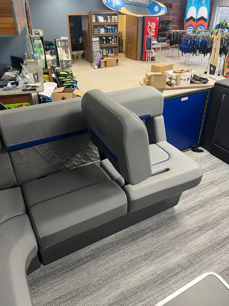 Slide: The Image of 2025 Bennington 24 MSB boat interior with gray seating and modern design. - 7