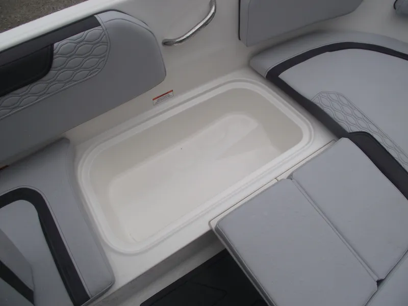Slide: The Image of 2025 Bayliner Element M15 boat interior seating with storage compartment. - 10