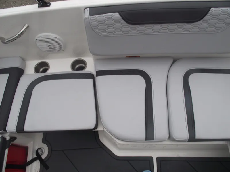 Slide: The Image of 2025 Bayliner Element M15 boat interior with cushioned seating and cup holders. - 11