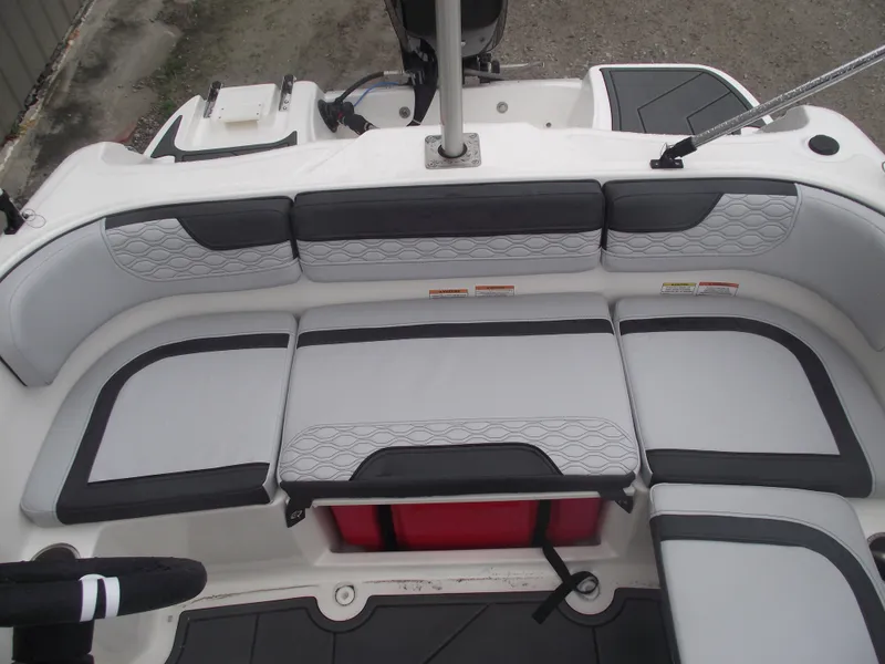 Slide: The Image of 2025 Bayliner Element M15 boat interior with cushioned seating. - 15
