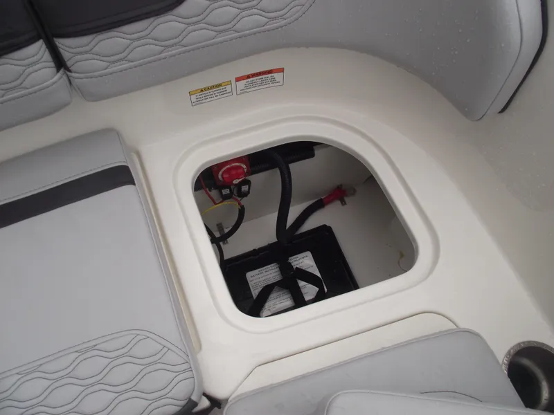 Slide: The Image of 2025 Bayliner Element M15 boat battery compartment with seating area. - 16