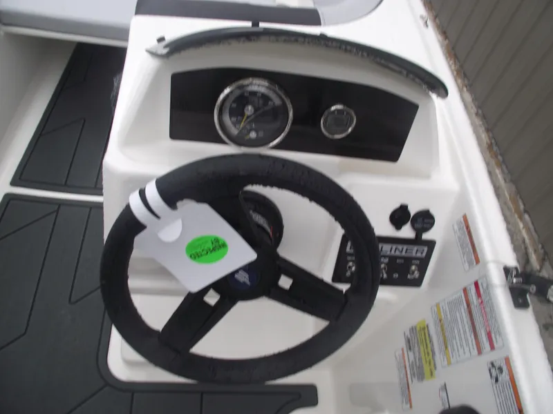 Slide: The Image of 2025 Bayliner Element M15 dashboard with steering wheel and gauges. - 19