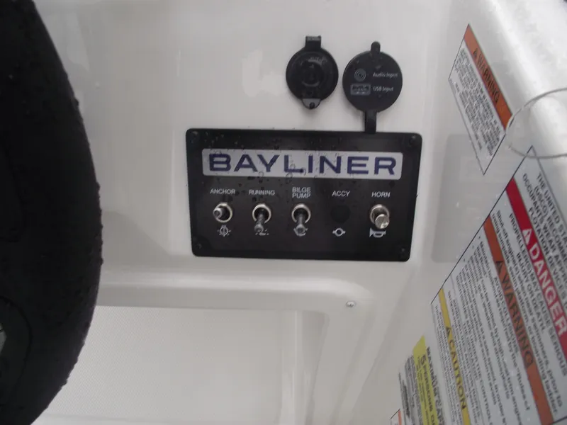 Slide: The Image of Control panel of 2025 Bayliner Element M15 boat with labeled switches. - 20