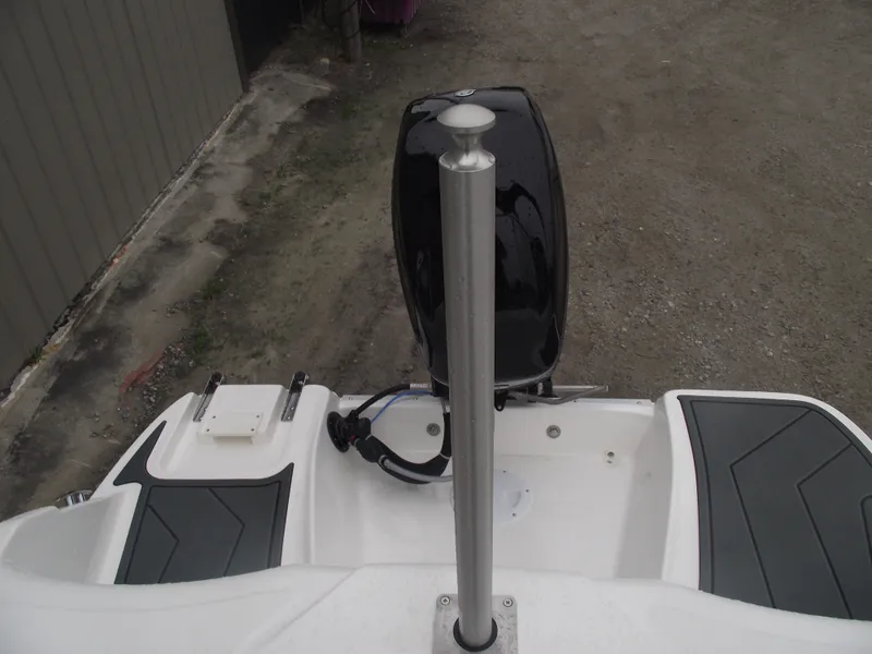 Slide: The Image of 2025 Bayliner Element M15 boat stern with motor and deck details. - 21