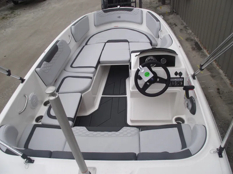 Slide: The Image of 2025 Bayliner Element M15 boat interior with gray seating and steering console. - 22