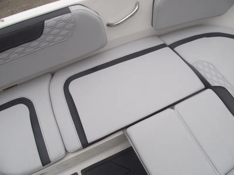 Slide: The Image of 2025 Bayliner Element M15 boat interior with sleek gray seating and modern design. - 9