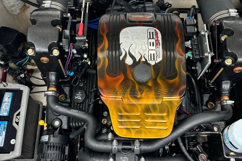 Slide: The Image of Engine of a 1998 Wellcraft Scarab 30 boat with custom flame design. - 8