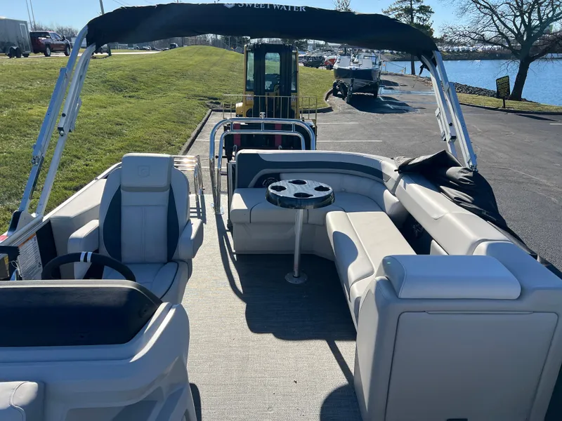 Slide: The Image of 2025 Godfrey Sweetwater 2286 C Special Edition pontoon boat with spacious seating and canopy. - 10