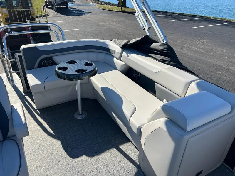 Slide: The Image of 2025 Godfrey Sweetwater 2286 C Special Edition pontoon boat with comfortable seating and cup holders. - 11