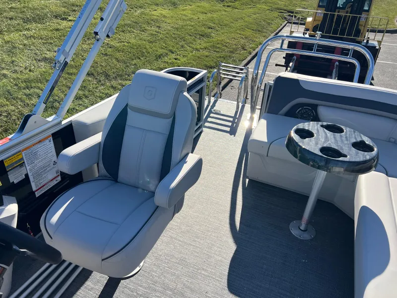 Slide: The Image of 2025 Godfrey Sweetwater 2286 C Special Edition boat interior with seating and cup holders. - 12