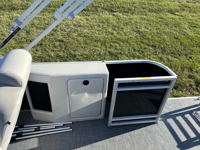 Slide: The Image of 2025 Godfrey Sweetwater 2286 C Special Edition boat storage compartment open on deck. - 13