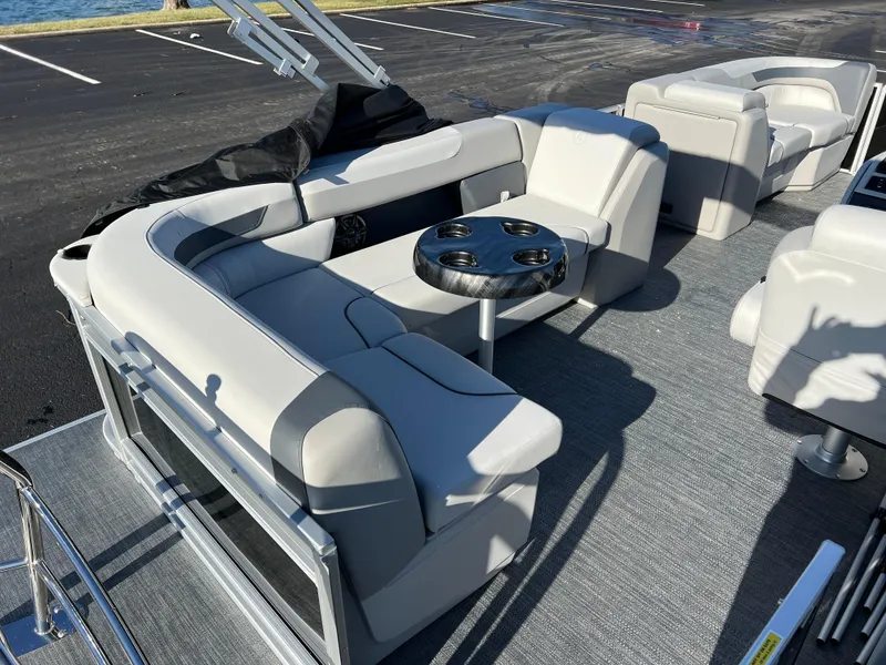 Slide: The Image of 2025 Godfrey Sweetwater 2286 C Special Edition pontoon boat with plush seating and cup holders. - 16