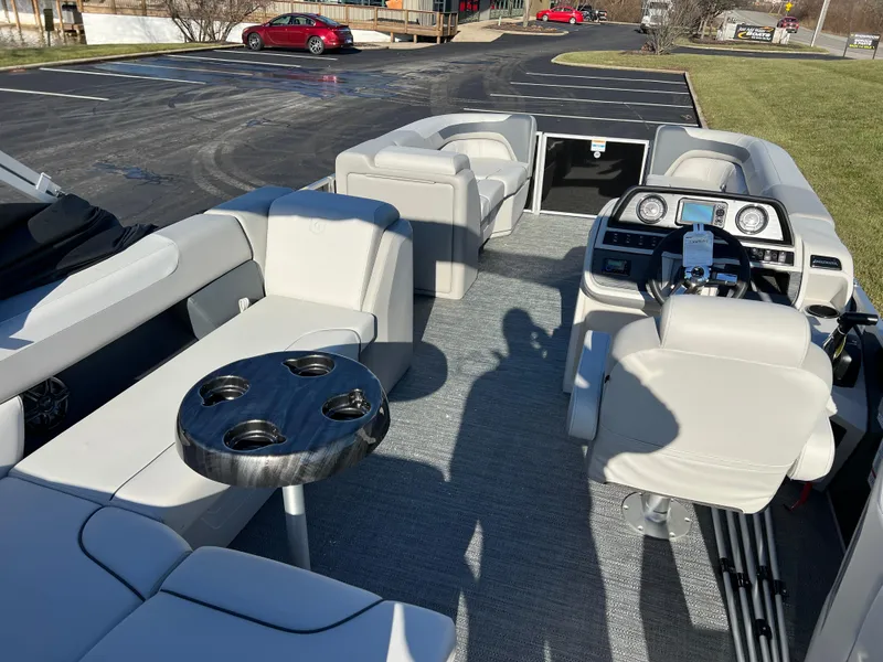 Slide: The Image of 2025 Godfrey Sweetwater 2286 C Special Edition pontoon boat interior with seating and control panel. - 17