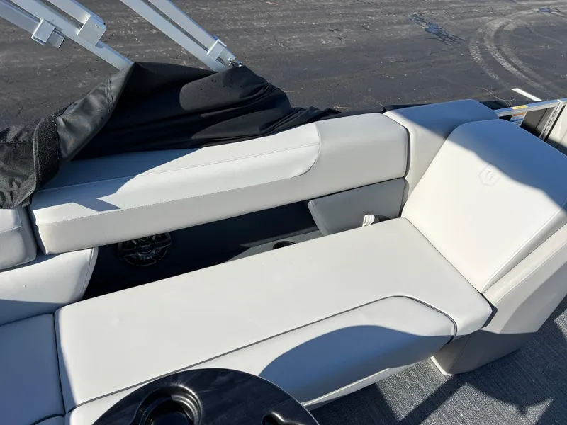 Slide: The Image of 2025 Godfrey Sweetwater 2286 C Special Edition boat interior with white seating. - 18