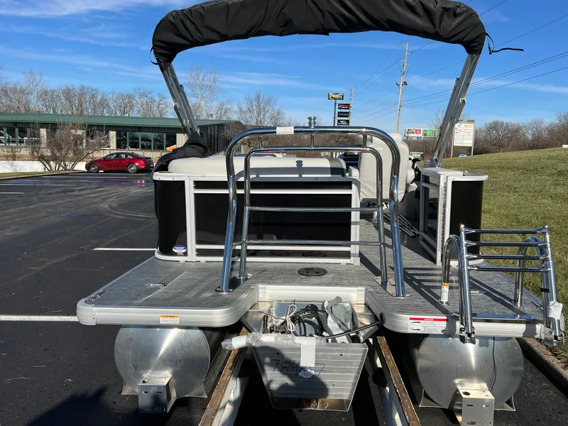 Slide: The Image of 2025 Godfrey Sweetwater 2286 C Special Edition pontoon boat in parking lot, rear view. - 5