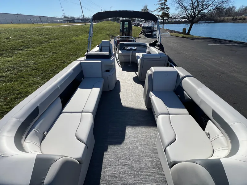 Slide: The Image of 2025 Godfrey Sweetwater 2286 C Special Edition pontoon boat with spacious seating and modern design. - 6