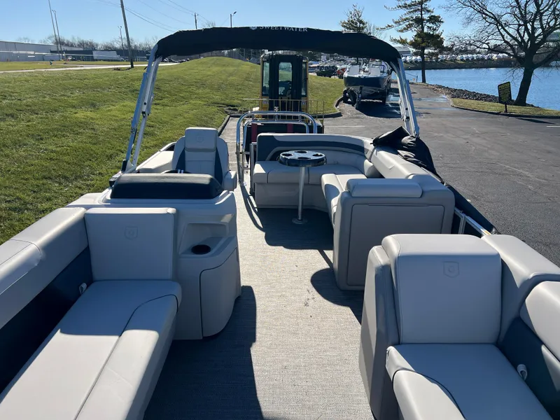 Slide: The Image of 2025 Godfrey Sweetwater 2286 C Special Edition pontoon boat with spacious seating and canopy. - 9