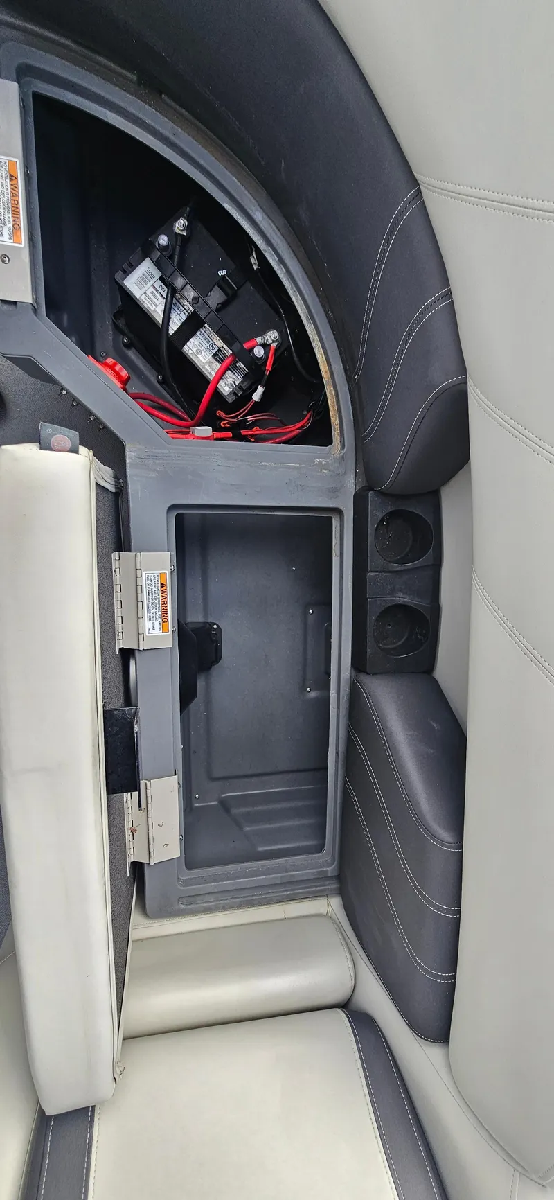 Slide: The Image of 2023 Sylvan Mirage X3 Tritoon interior storage compartment with battery and wiring. - 15
