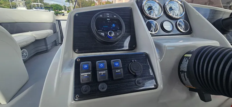 Slide: The Image of Dashboard of 2023 Sylvan Mirage X3 Tritoon with controls and gauges. - 9