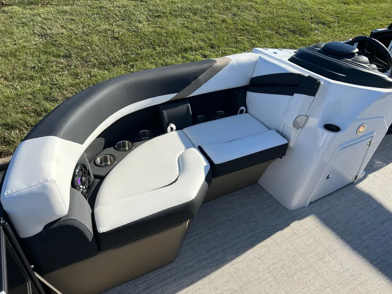 Slide: The Image of 2025 South Bay 222 RS boat interior with cushioned seating and cup holders. - 10