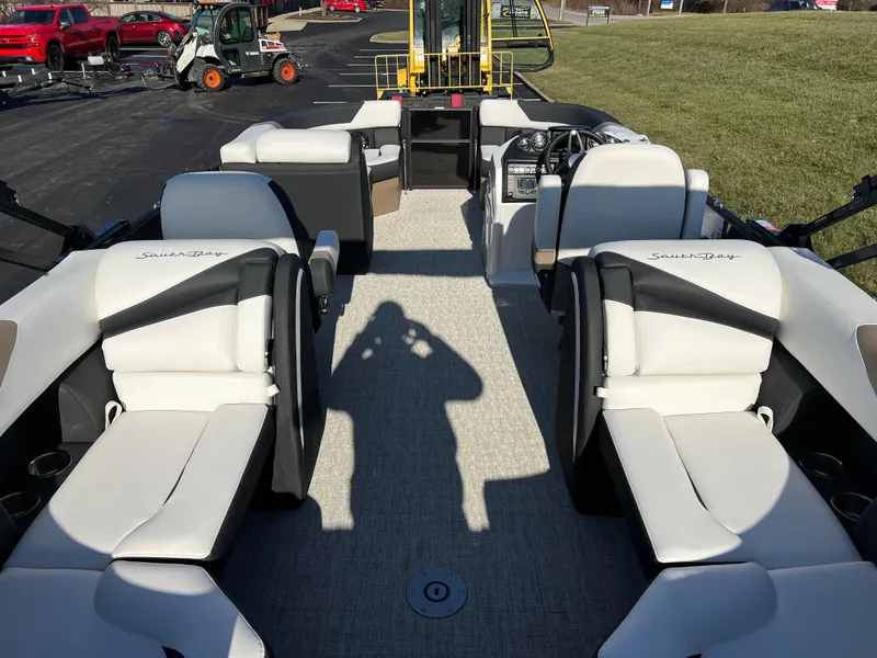 Slide: The Image of 2025 South Bay 222 RS pontoon boat interior with plush seating and modern design. - 17