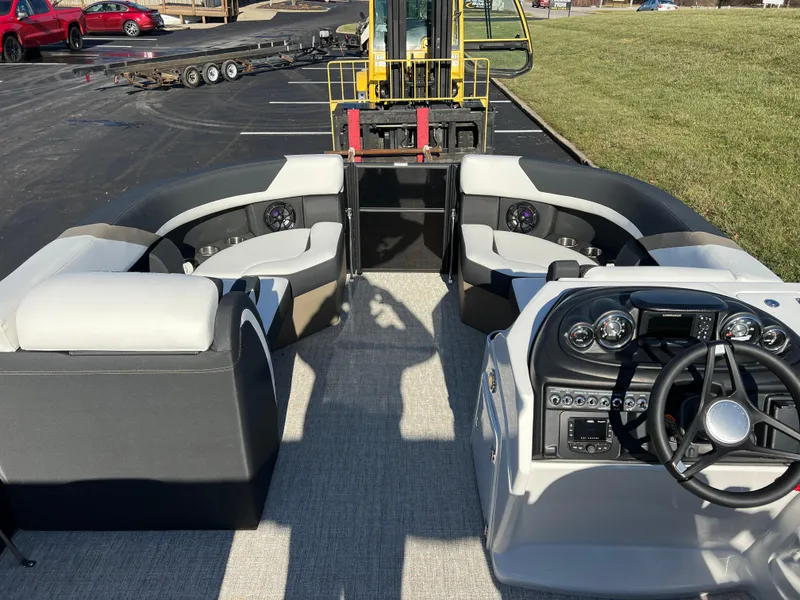 Slide: The Image of 2025 South Bay 222 RS pontoon boat interior with steering console and seating. - 20