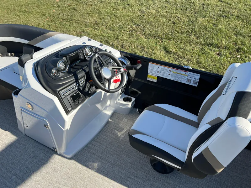 Slide: The Image of 2025 South Bay 222 RS boat interior with modern steering console and comfortable seating. - 21