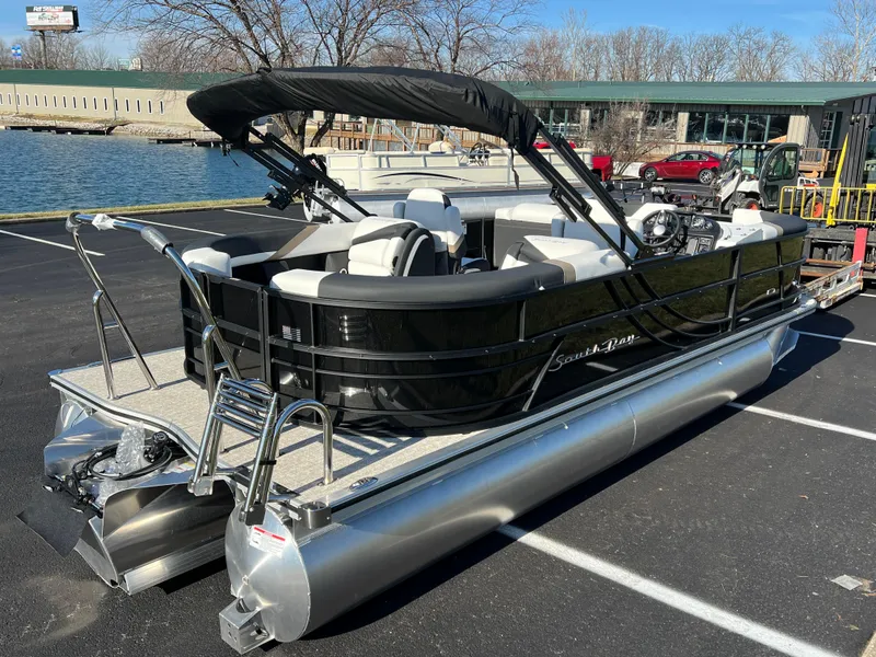 Slide: The Image of 2025 South Bay 222 RS pontoon boat parked near a lake. - 4