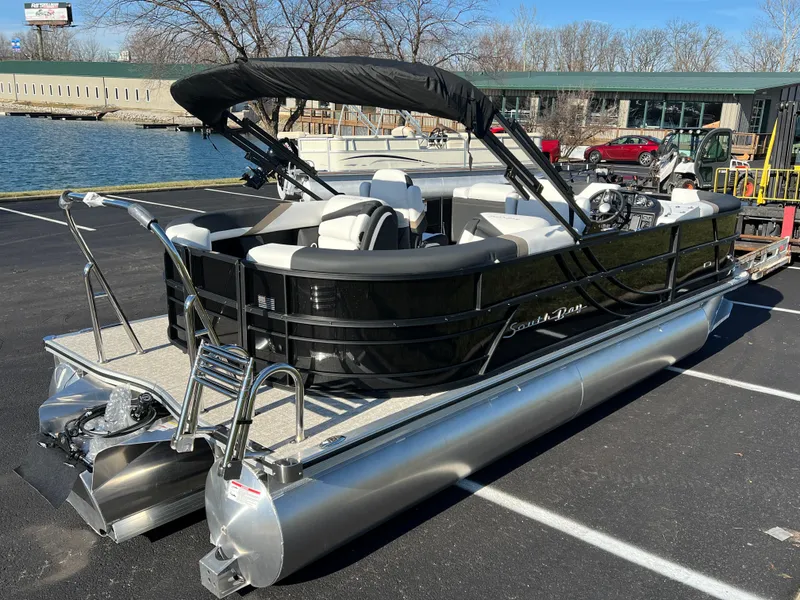 Slide: The Image of 2025 South Bay 222 RS pontoon boat docked near a lake. - 5