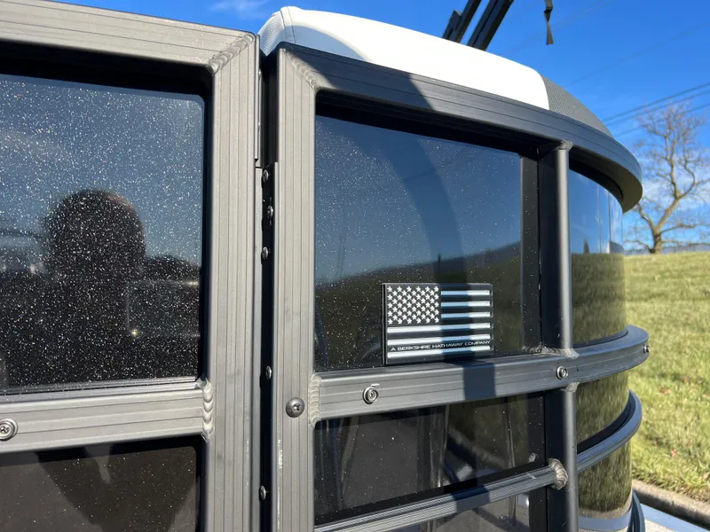 Slide: The Image of Close-up of 2025 South Bay 222 RS pontoon with American flag decal. - 7