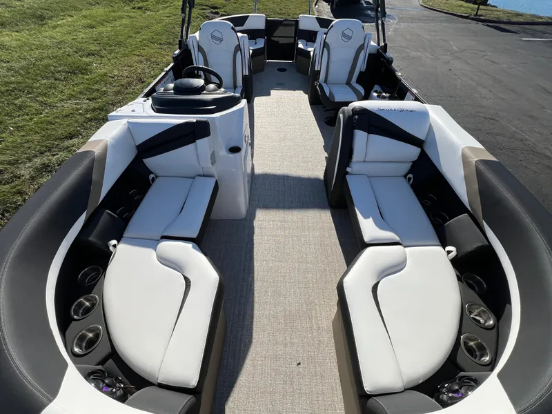 Slide: The Image of 2025 South Bay 222 RS pontoon boat interior with plush seating and modern design. - 8