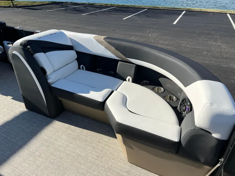 Slide: The Image of 2025 South Bay 222 RS boat interior with stylish seating and cup holders. - 9