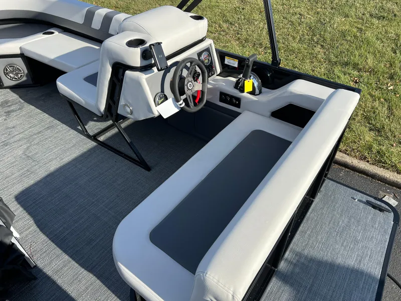 Slide: The Image of 2025 Godfrey Mighty G 1476 C boat interior with modern seating and steering console. - 14