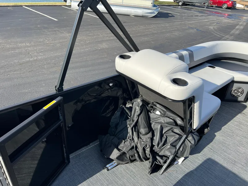 Slide: The Image of 2025 Godfrey Mighty G 1476 C boat interior with seating and storage area. - 16