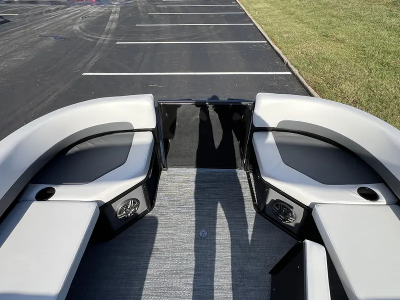 Slide: The Image of 2025 Godfrey Mighty G 1476 C boat interior with gray seating and cup holders. - 18