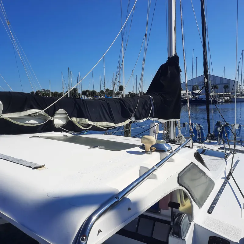 Slide: The Image of 2006 Gemini 105 MC sailboat docked in marina under clear blue sky. - 18