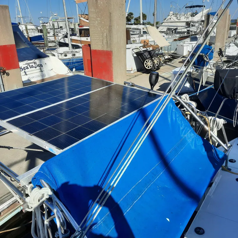 Slide: The Image of Solar panels on a 2006 Gemini 105 MC catamaran docked at a marina. - 19