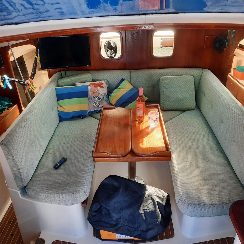 Slide: The Image of Cozy interior of 2006 Gemini 105 MC catamaran with seating, table, and decor. - 4