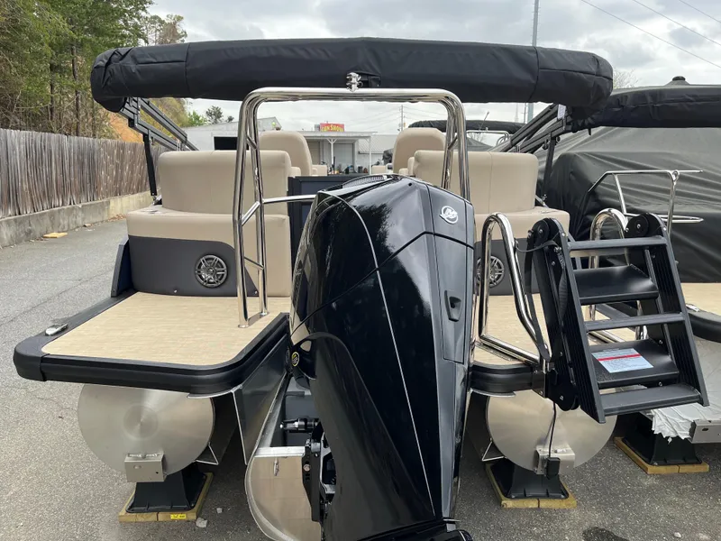 Slide: The Image of 2025 Harris Cruiser 230 pontoon boat with outboard motor and seating. - 5